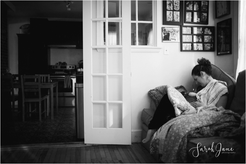 Breastfeeding at home photograph black and white