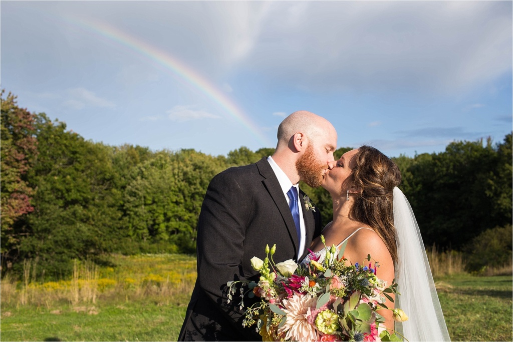 Bride Groom Kissing Maine Wedding Rainbow in the Sky