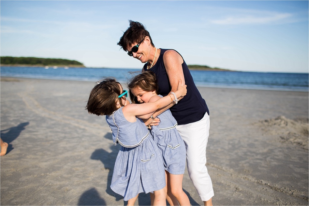 Grandmother playing with grandkids on the beach Goose ROcks Beach Kennebunk Maine