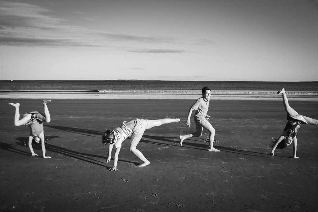 Kids doing cartwheels on the beach Old Orchard beach Maine Family Photographer