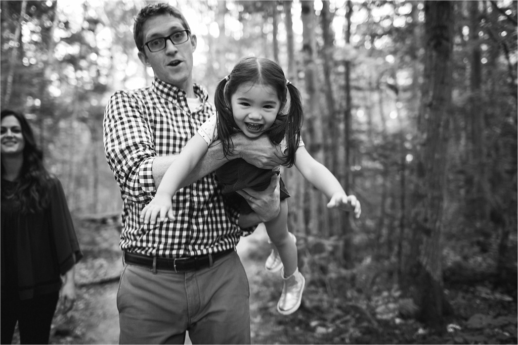 Dad giving child airplane ride, black and white photo, family portraitsMaine Family Photographer